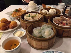 A variety of dim sum dumplings and side dishes