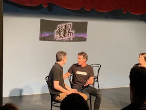2 people on stage at an improv class
