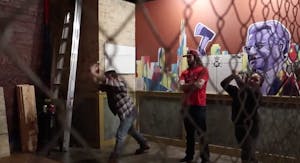 two people throwing axes