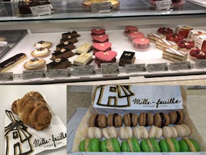 various pastries and desserts in the window of a bakery