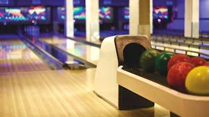colorful bowling balls and a bowling lane