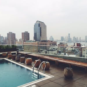 a rooftop pool overlooking a city