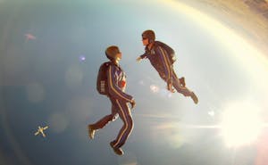 Team Building Indoor Sky Diving. Two people sky diving