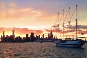 tall ship windy setting sail at sunset in Chicago