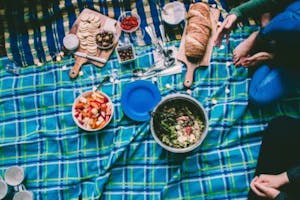 looking down at a picnic set up on a turquoise blanket