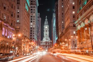 a view of a city street in Philly at night