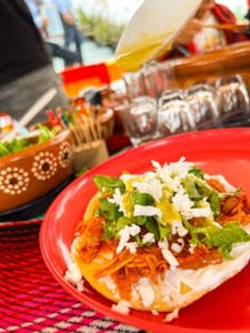 a plate of Mexican food on a table