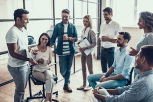 Group of Young Business People Chatting on Break in Office