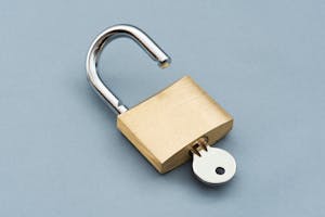 A lock with a key in it unlocked