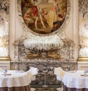 beautiful royal dining room with ornate art and marble