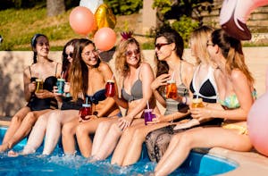 Group of girls at a bachelorette party in the pool