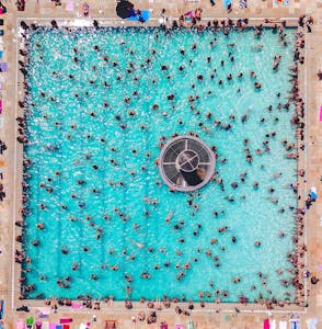 People Swimming in a busy Pool