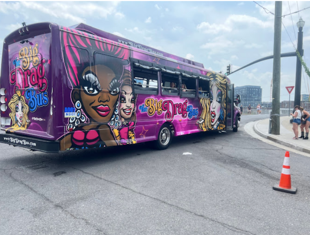 a colorful bus is parked on the side of a road