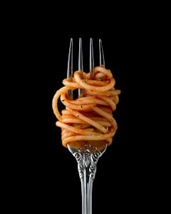 a fork with pasta on it