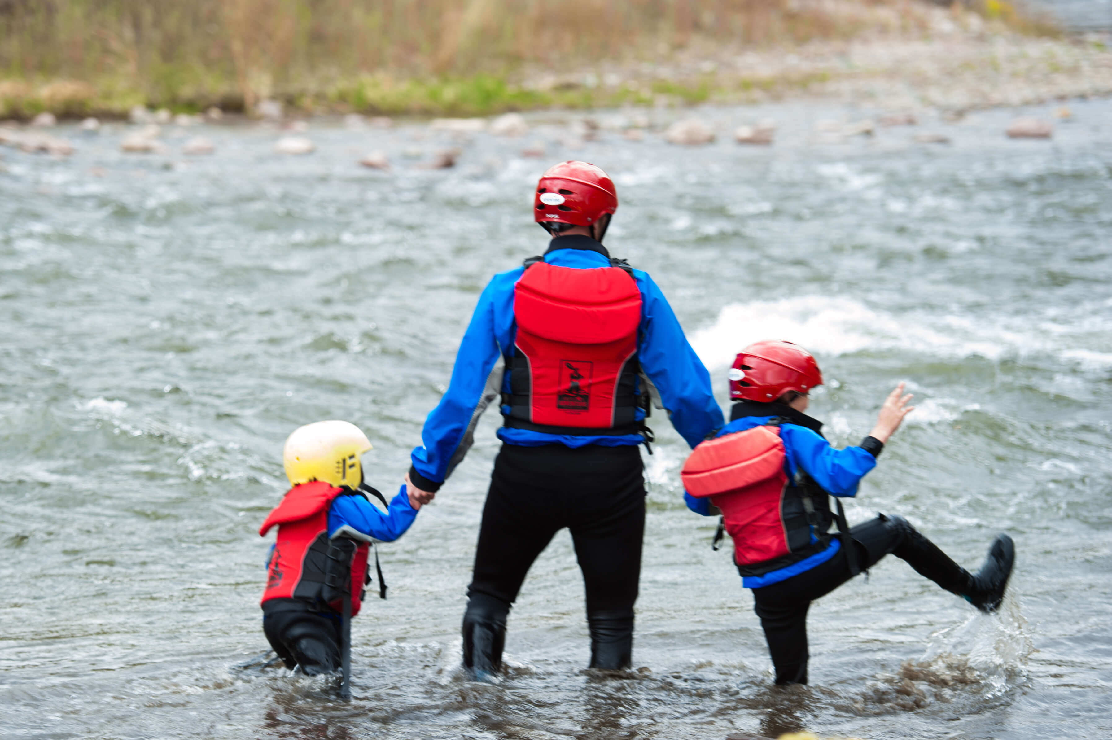 white water rafting with kids playing in river