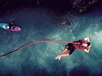 Man above water after bungee jumping in Whistler