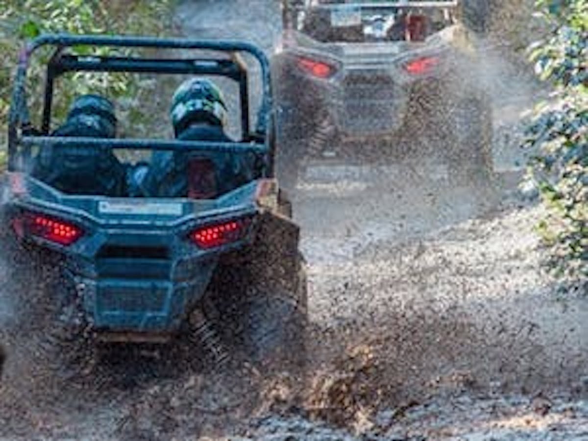 Rzr tour in Whistler through a mud puddle.