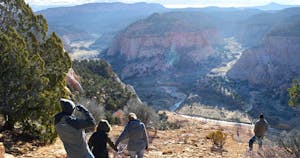 A family walking together and enjoying a Zion Jeep Tour at one of the scenic locations in Red Canyon