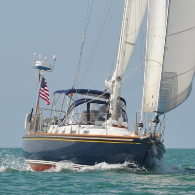 Moment sailboat cruising through the watert