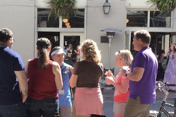 A tour group learning more about the French Quarter