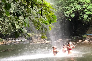 Girls bathing in a river