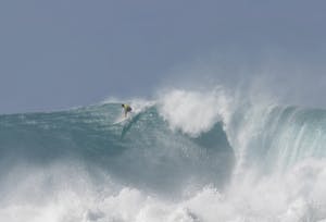 a man riding a wave in the ocean