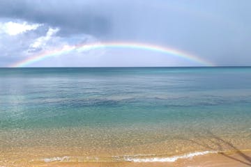 a rainbow over a body of water