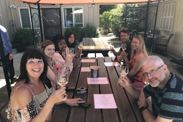 happy tour group at wine tasting