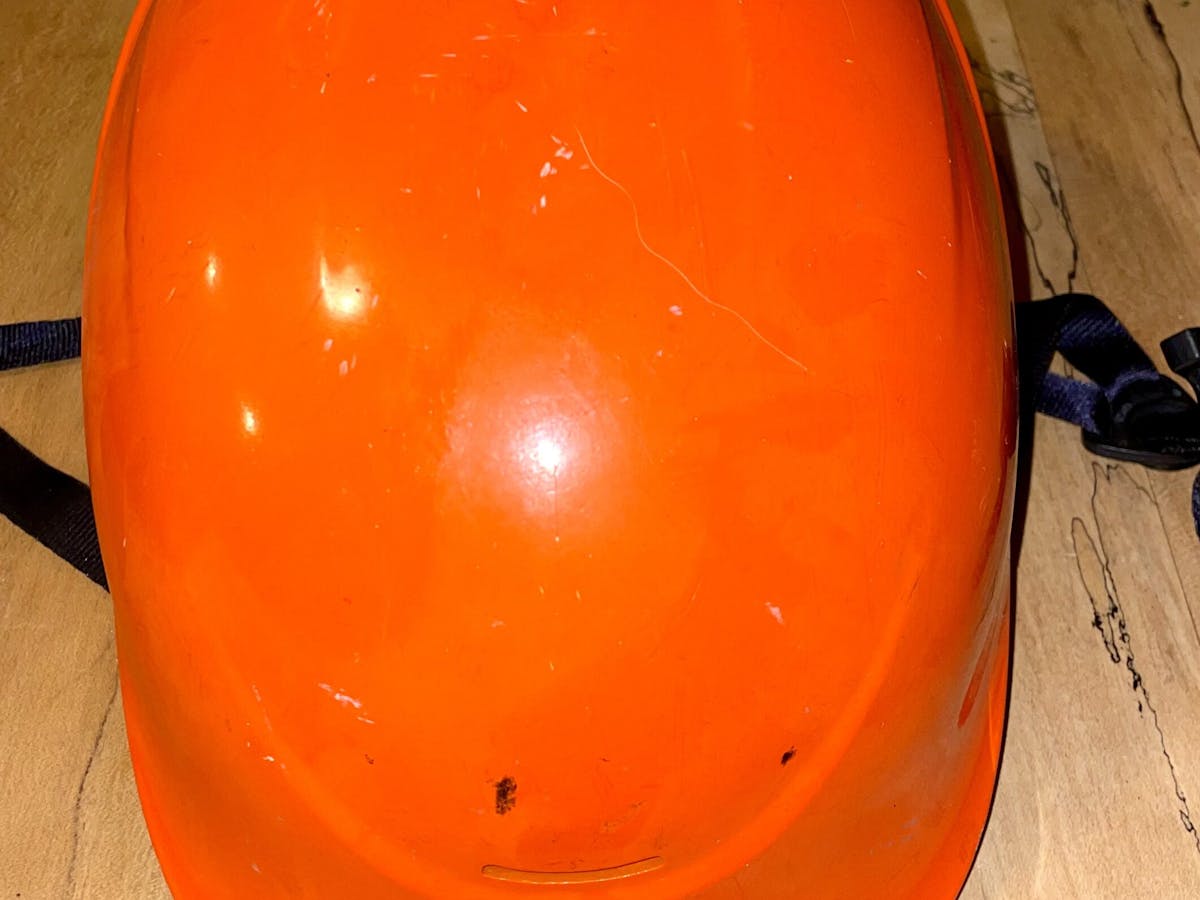 an orange and white helmet