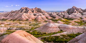 a canyon with Badlands National Park in the background