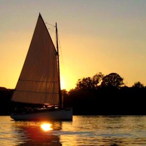 Sip Champagne and get lost in the mesmerizing sunset views of the Eastern Shore on Sail Selina II's exclusive sailboat excursion in St Michaels, MD