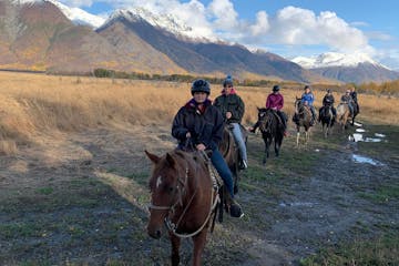 Horseback riders on a trail in Alaska