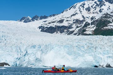 tandem kayaking near a glacier
