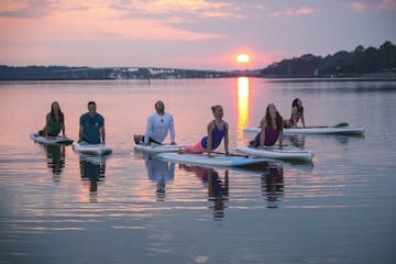 Yoga group on paddle boards