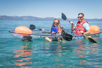 father and daughter kayaking
