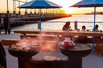 bbq on the river at sunset