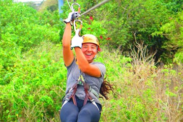 A girl is all smiles as she ziplines