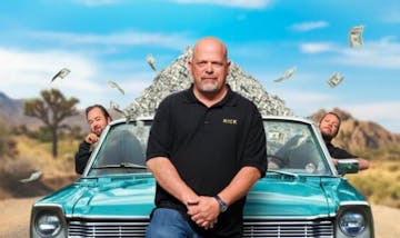 Rick Harrison standing in front of a car posing for the camera