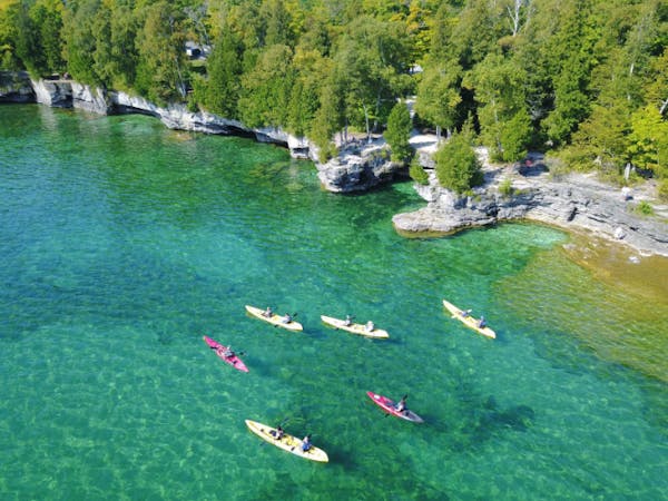 Door County coastline with kayaks in water