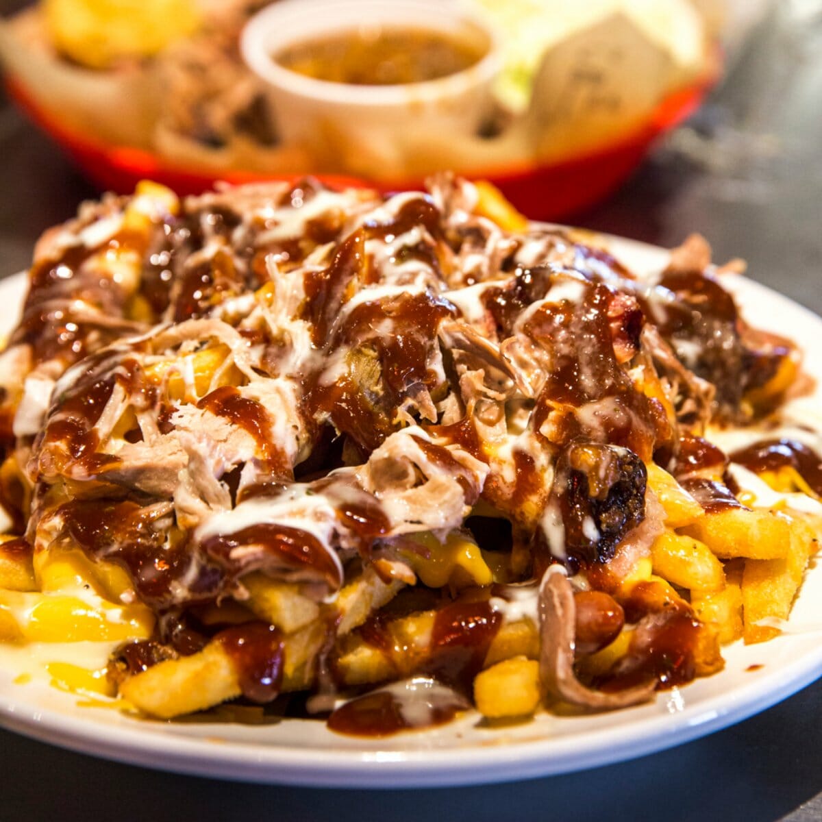 Barbecue chicken on french fries named "Frychos"
