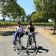 Two Girls on a bike path in a vineyard