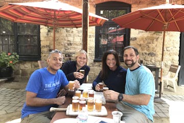 Group enjoying beers at a table