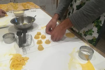 a person making pasta in Tuscany