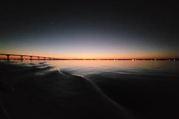 a sunset over a body of water