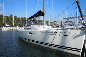 Front view of Sweet Freedom sailboat while docked
