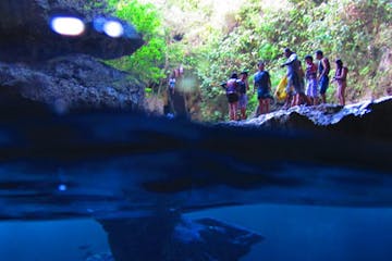 A group of guests prior to jumping into the grotto waters