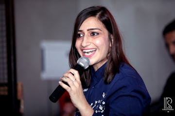 a woman holding a microphone