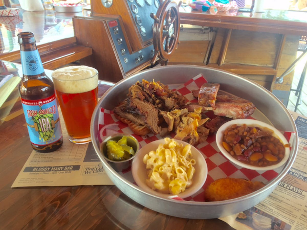 Big BBQ platter with beer on patio table