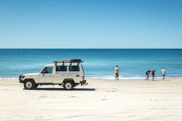 a truck on a sandy beach