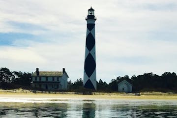 cape lookout lighthouse on water